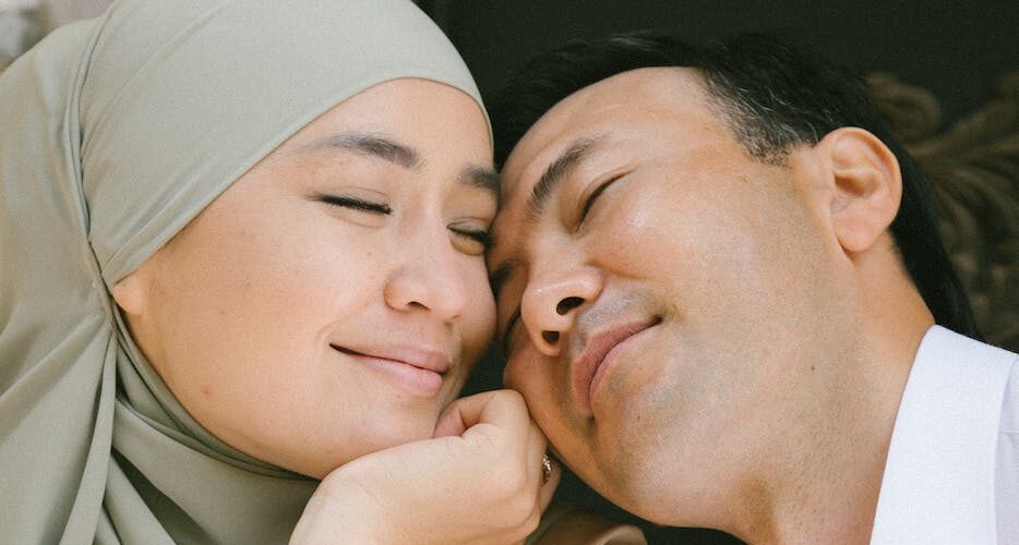 man and woman smiling together